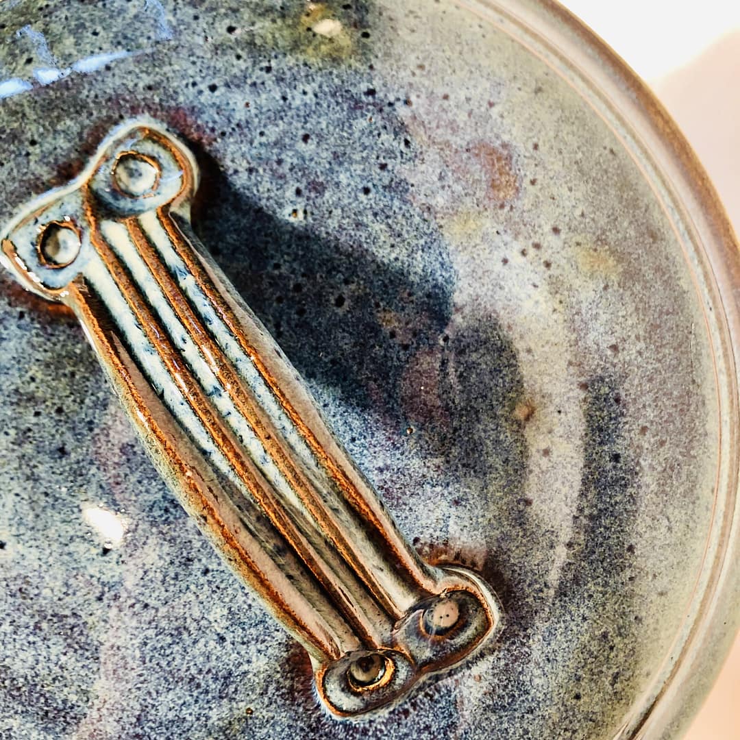 Details of the colors created by the routil blue glaze on the lid of a soupterine