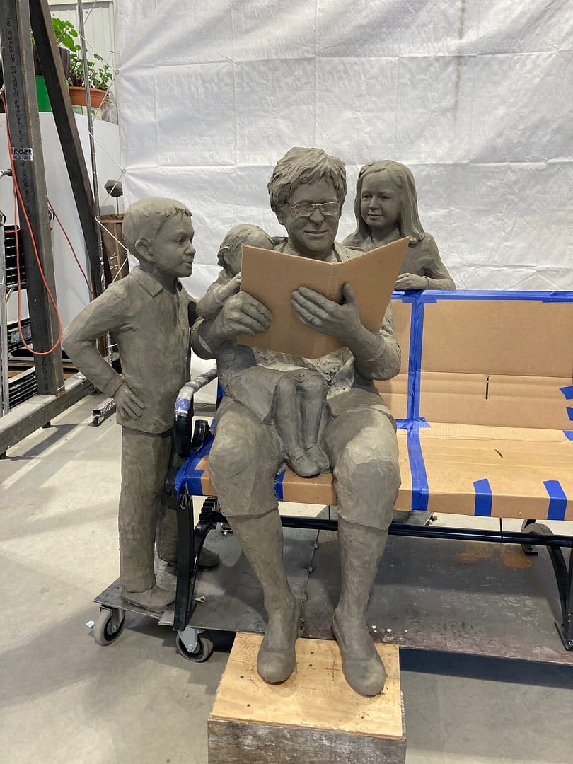 Clay rendering of the Katherine Meade and children sculpture in the studio