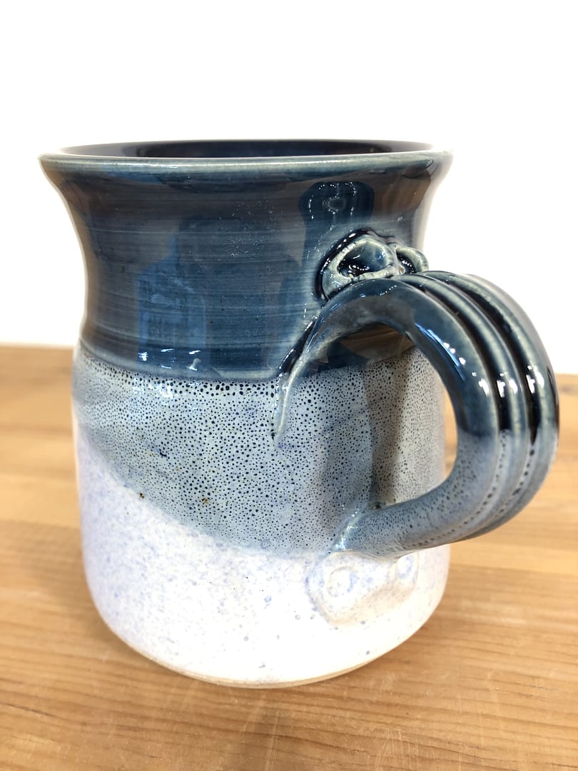 Detail of the layered blue glazes on the handle of a mug